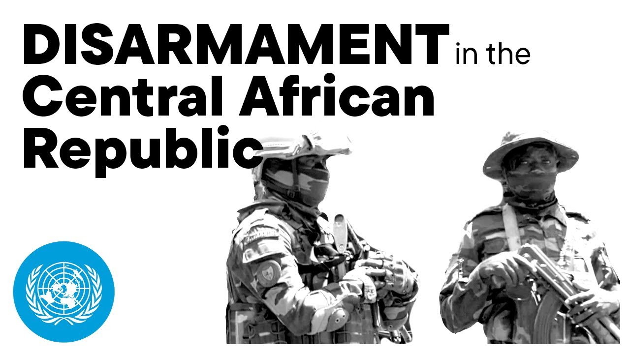 Two men in uniform carrying weapons.