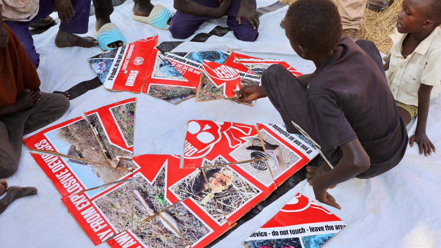 a child is piecing together a puzzle
