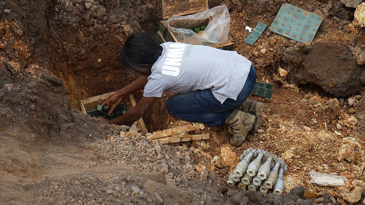 a woman is working in a field