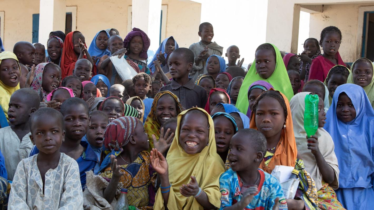 many children are sitting on the floor