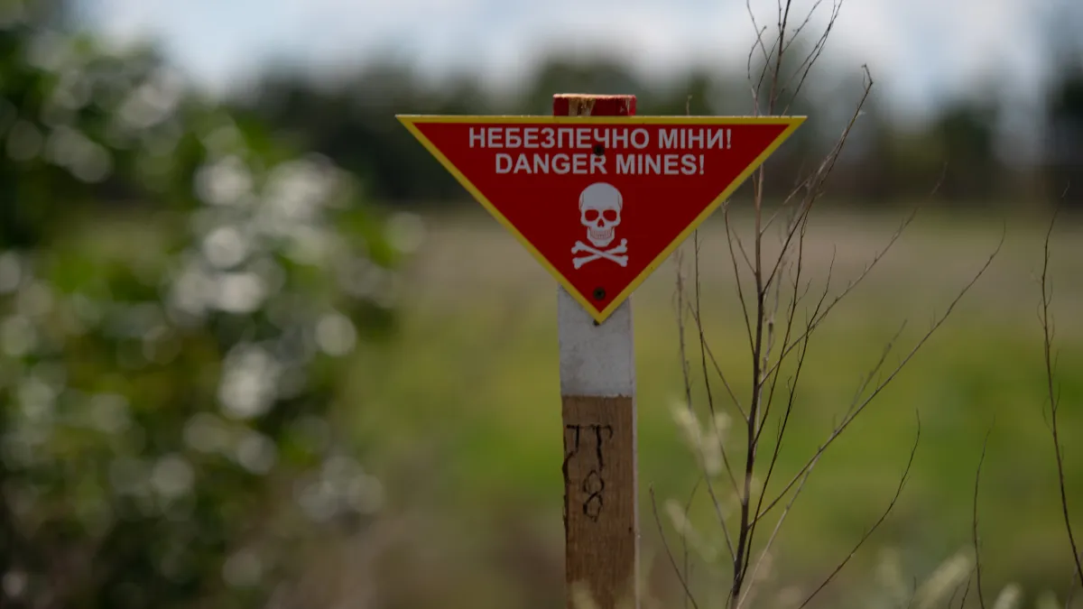 a red sign of explosive hazard area