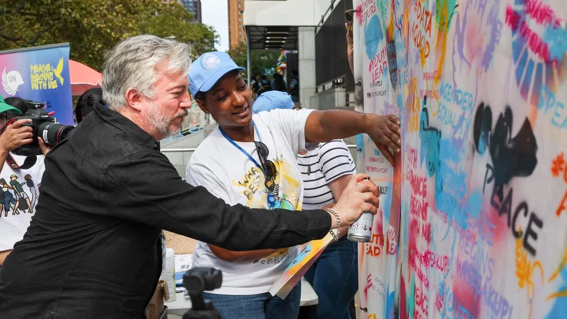 giles duley at the summit ofmthe future action days graffiti