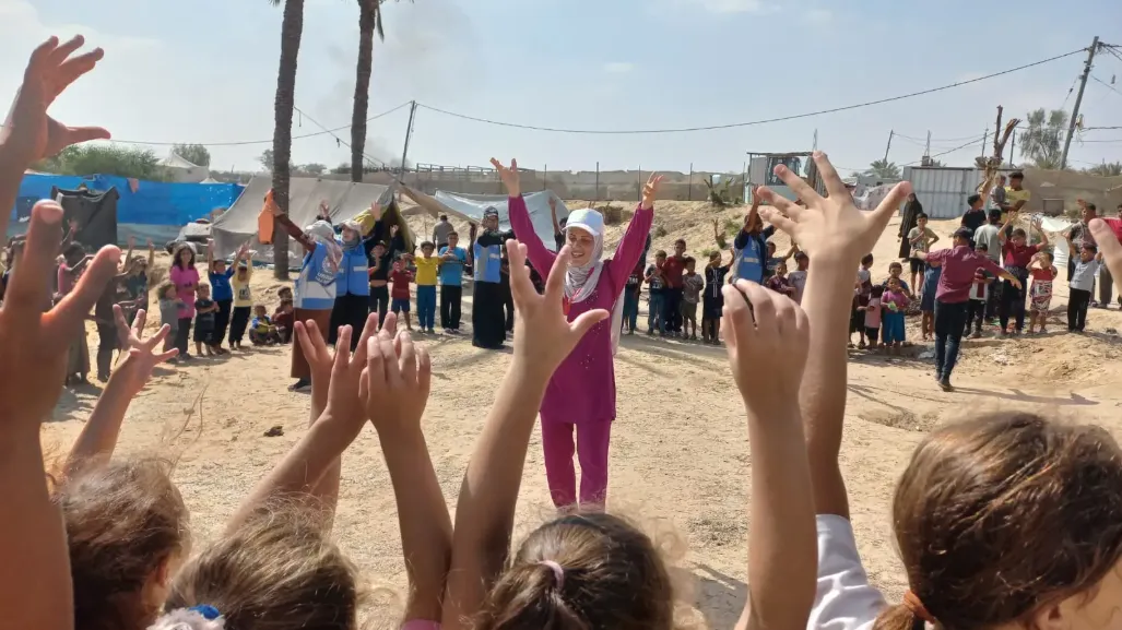 The Palestinian Organization for Development (POD) Risk Education Officer  providing an EORE session for children in Khan Younes - Al Mawasi, Middle Area, Gaza Strip, June 2024