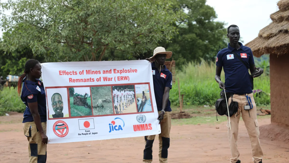 NMAA Survey and EORE team members conduct an EORE session in Odemo Village as part of their operational deployment.