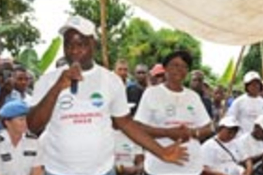 In a village in the Kono district on Monday, Jens Anders Toyberg-Frandzen, the Secretary-General's Executive Representative, speaks at an outdoor event by hundreds of school children of all ages.