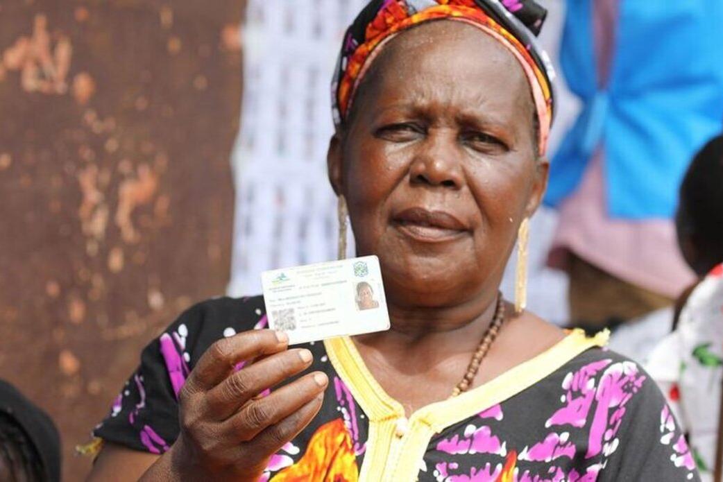 A voter in Central African Republic displays her ID.