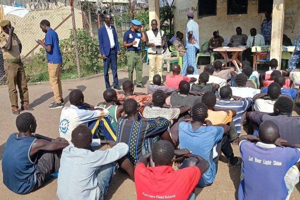 group of people sitting on the ground.