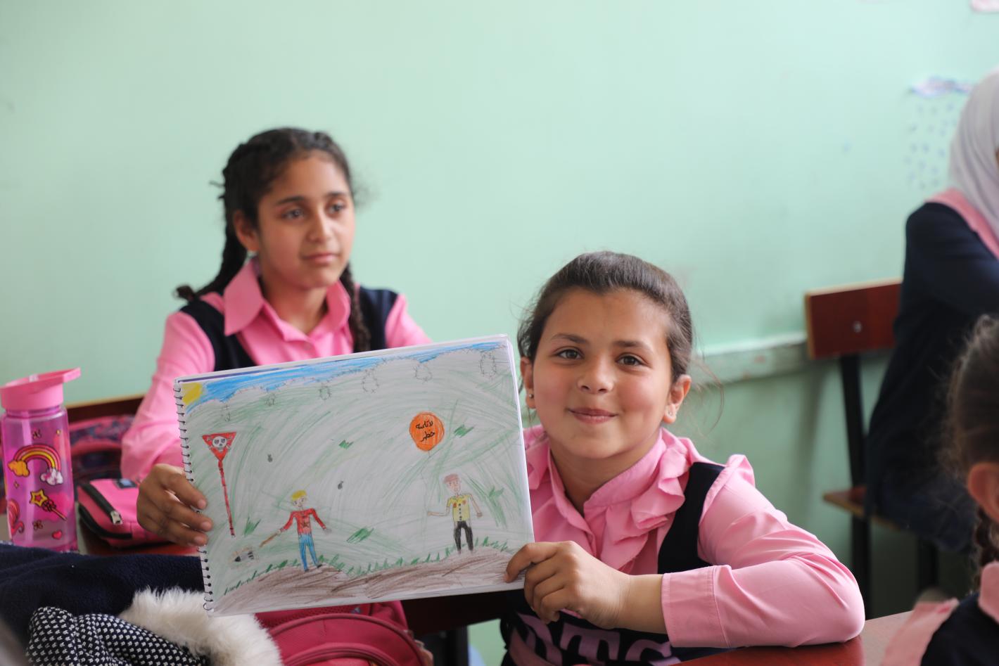 Drawing activity called "painting for peace" at Darraya School in Rural Damascus, focusing on Explosive Ordnance Risk Education. 