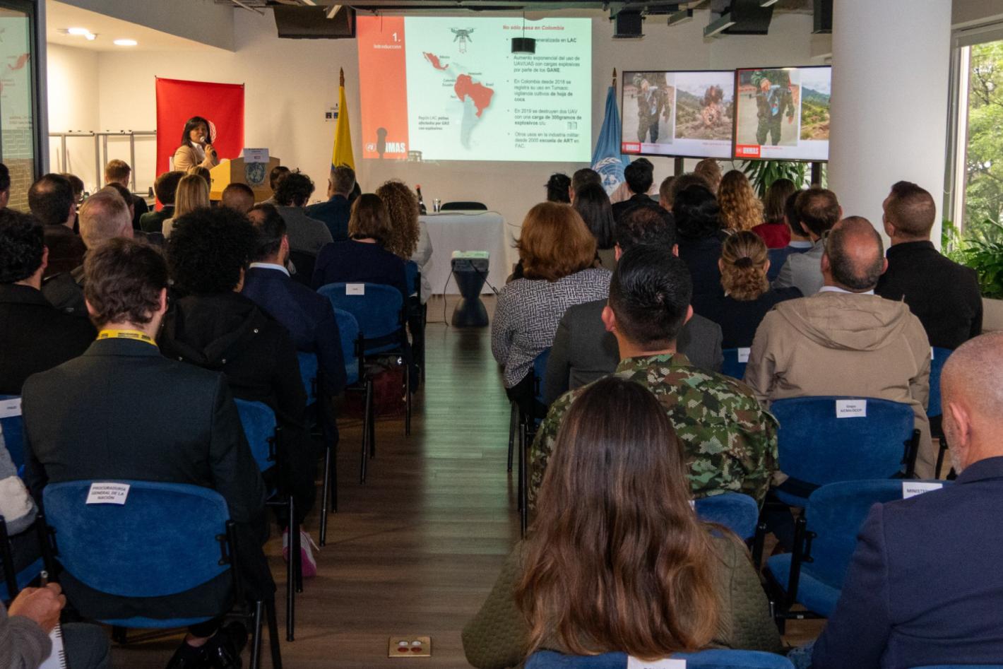people sitting down looking at a presentation