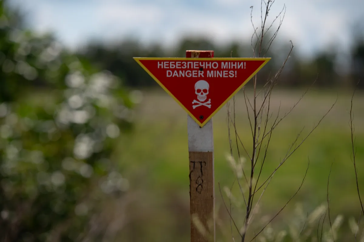 a red sign of explosive hazard area