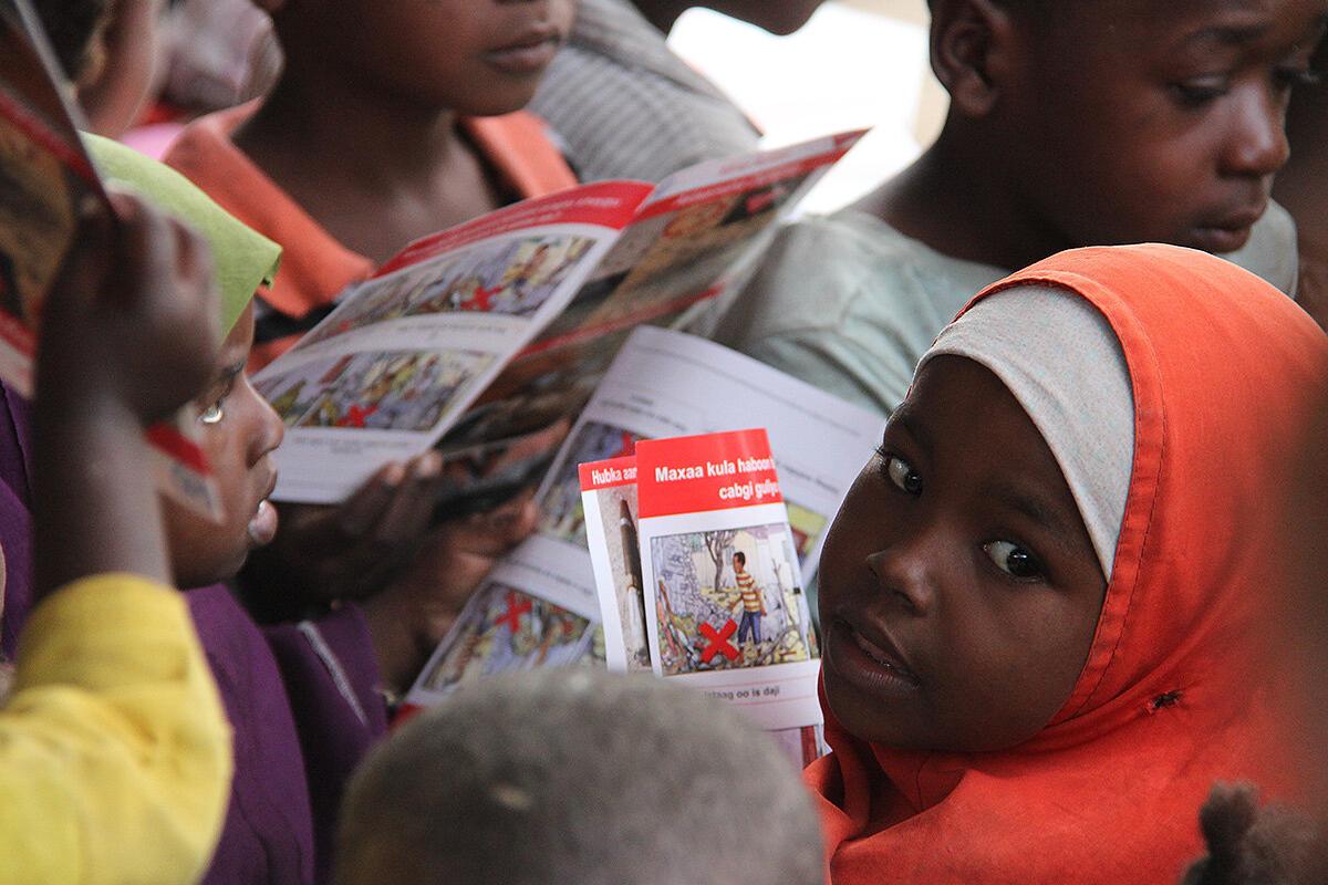 a close-up shot of a child looking back