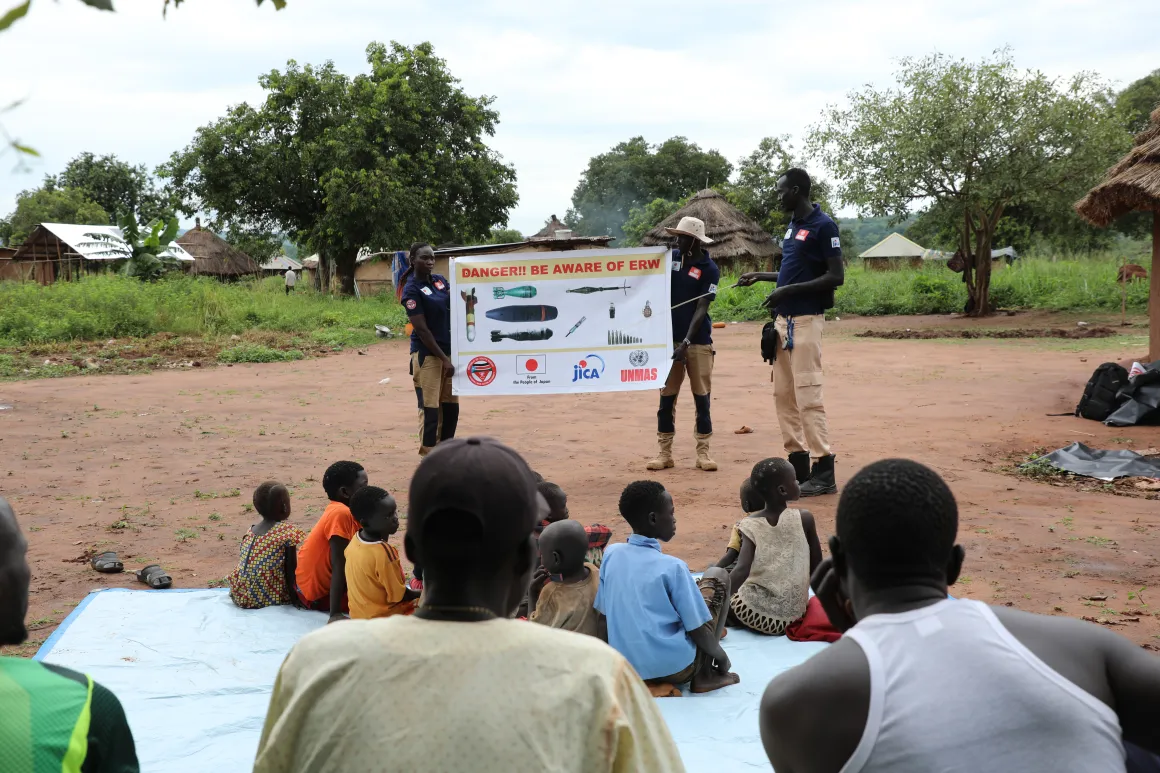 Children and community learn how to recognize explosive hazards and practice safe behaviour during and EORE session.