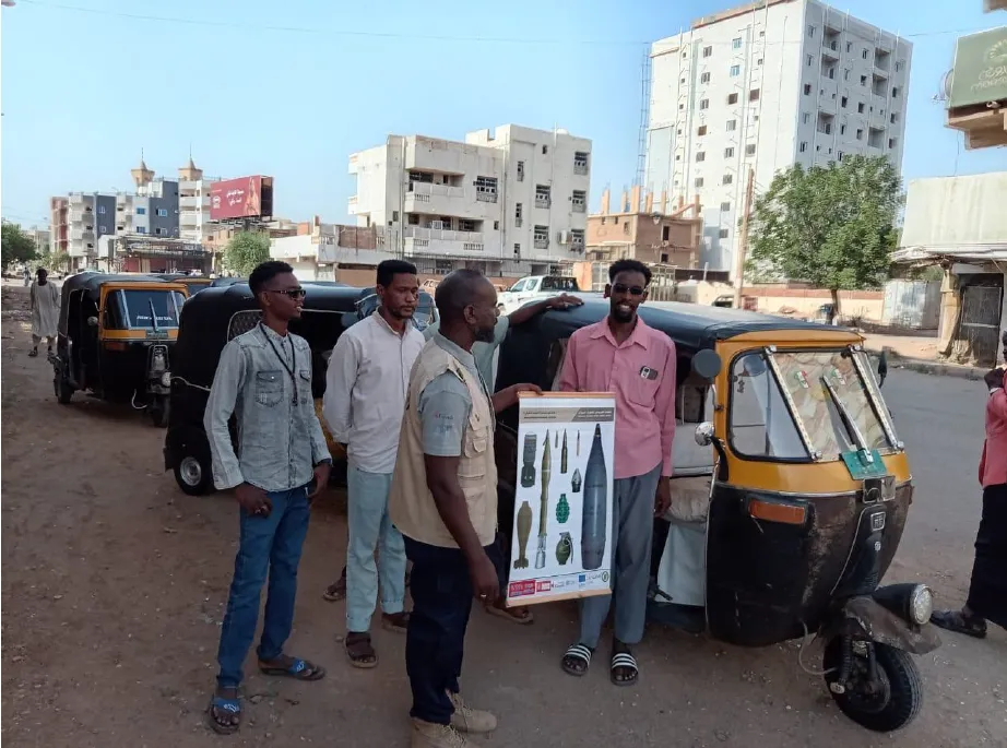 Community Liaison Officers conduct EORE outreach to local residents and drivers in Khartoum (Photo - UNMAS/SLG)