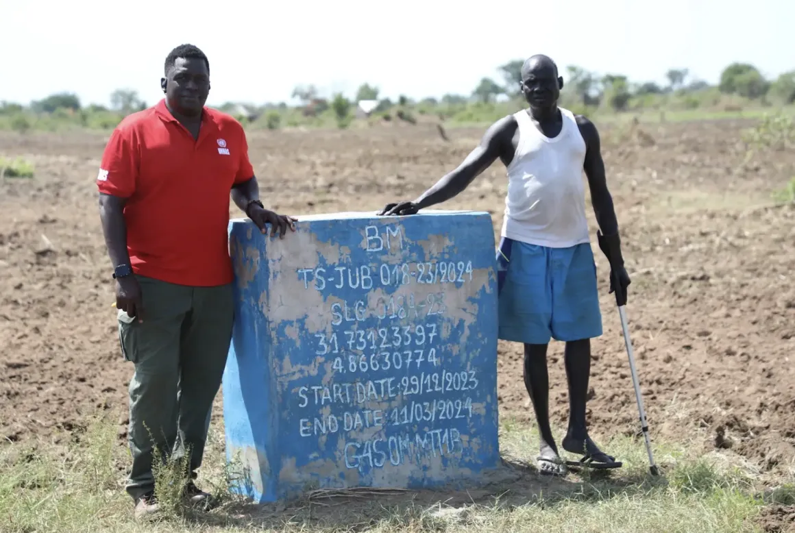 A UNMAS clearance marker on land in Bilinyang Payam that was previously contaminated by explosive hazards and later cleared for safe civilian use. The land is now used for farming and settlement.