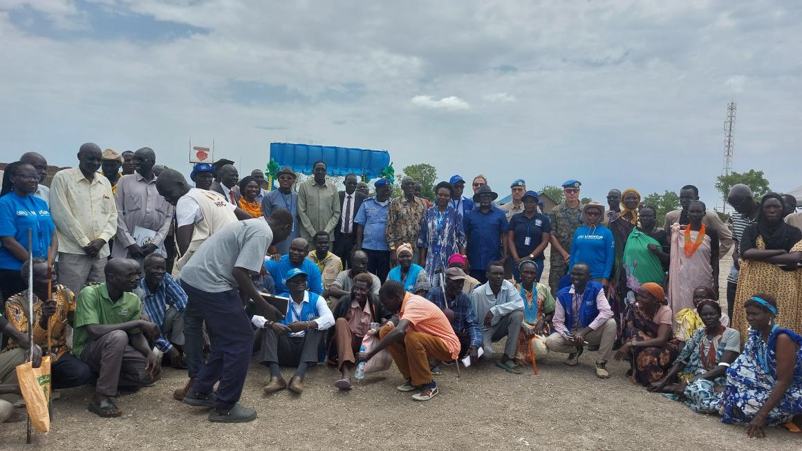 A group picture of communities members and staff